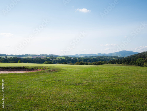 Fototapeta Naklejka Na Ścianę i Meble -  landscape with green grass and sky golf field