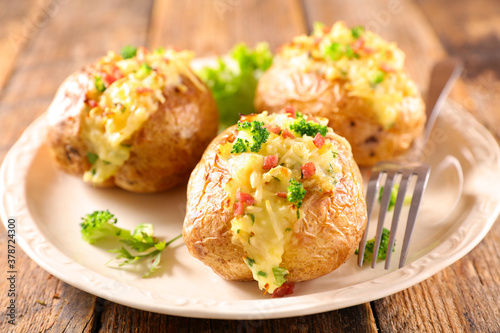 baked potato with cheese, cream and bacon