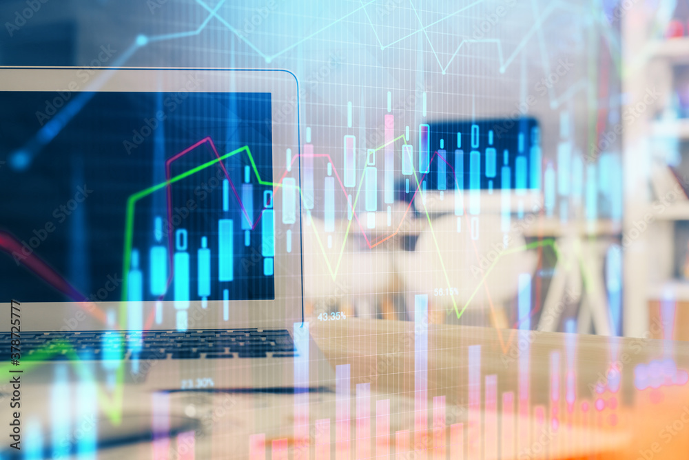 Forex Chart hologram on table with computer background. Double exposure. Concept of financial markets. Forex Chart hologram on table with computer background. Double exposure. Concept of financial markets.