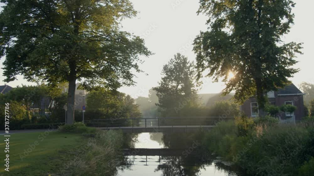 Walking down an ally with a bridge in the early morning. Walking down an ally with a bridge in the early morning.