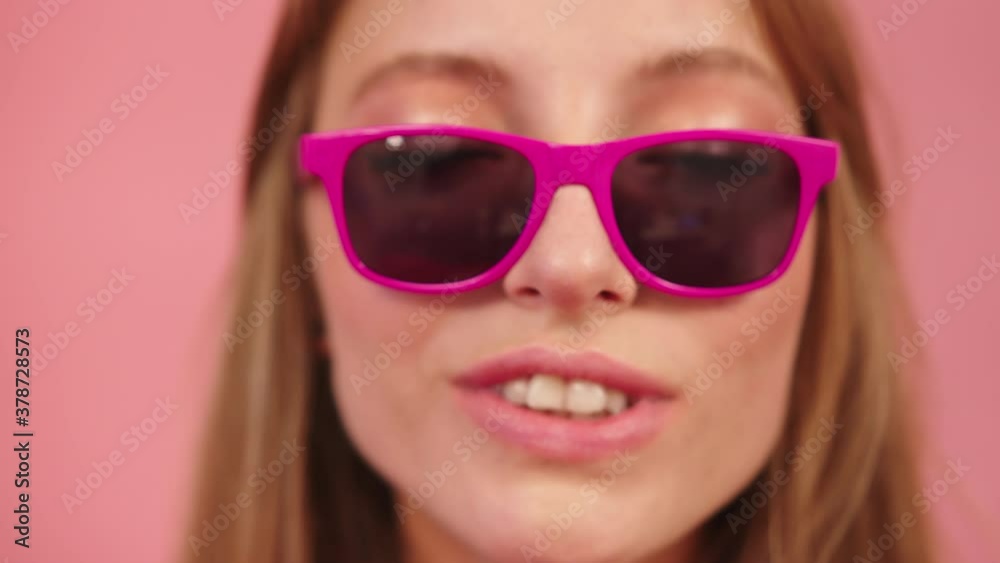 Girl On Pink Glasses Pout And Send Kiss On The Camera. - close up shot Girl On Pink Glasses Pout And Send Kiss On The Camera. - close up shot