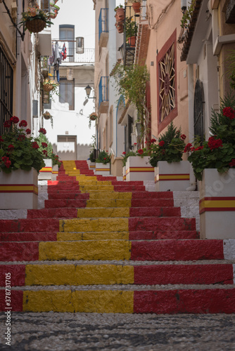 Street of the old town in the center of Calpe with the staircase painted with the colors of the Spanish flag, Alicante. Spain © JMDuran Photography