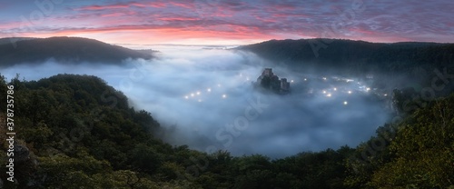 Hardegg medieval castle on a fortified hill upon Thaya river during summer or autumn time. Misty big ruins in the Thayatal Valley, National park, Lower Austria. The Smallest Austrian town.