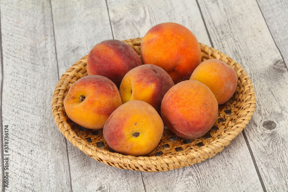 Peach heap in the wooden basket Peach heap in the wooden basket