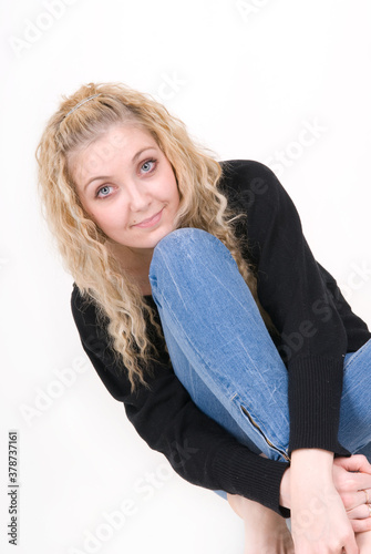 Young beautiful blonde woman alone on white background