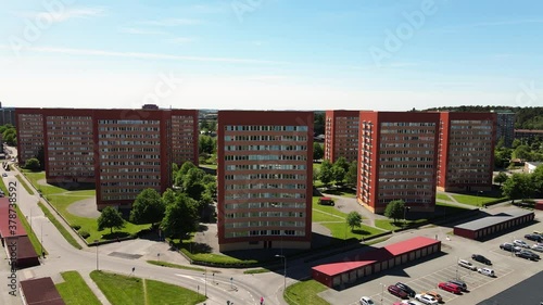 High-Rise Residential Buildings In A Row Under A Bright Sunny Day In Västra Frölunda, Gothenburg Sweden. - Aerial Drone Shot photo