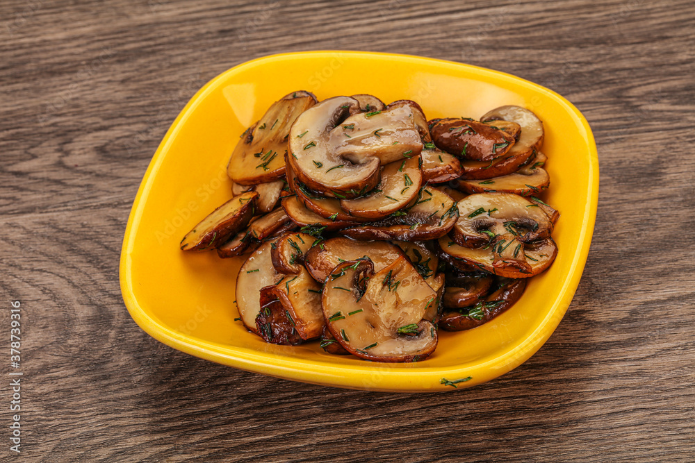 Roasted champignon with herbs and spices