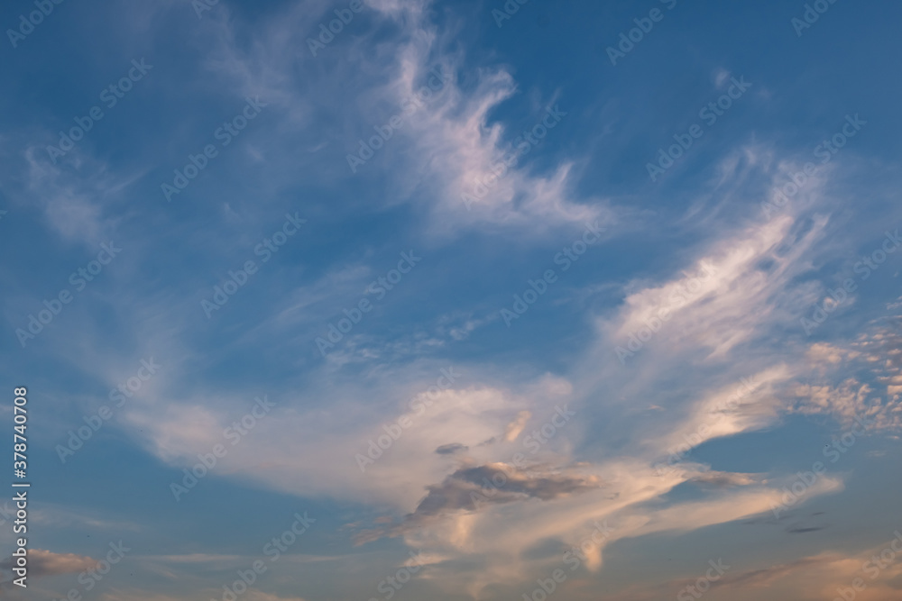 Blue sky background with white striped clouds. Clearing day and Good windy weather