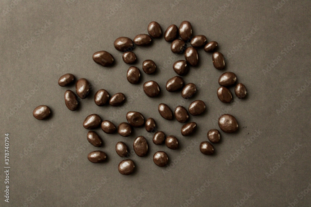 dark chocolate beans on a black background