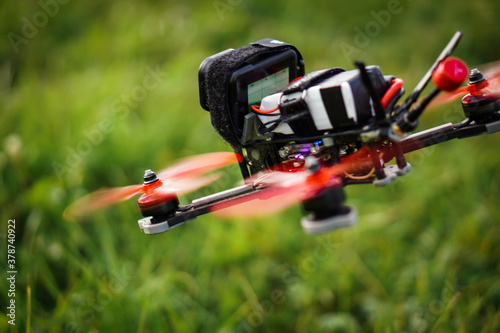 The flying racing drone is ready for the race.