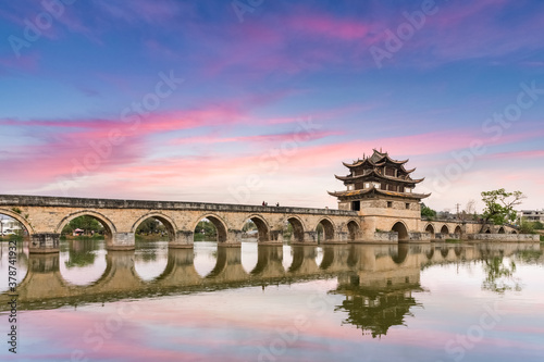 yunnan double dragon bridge in twilight photo