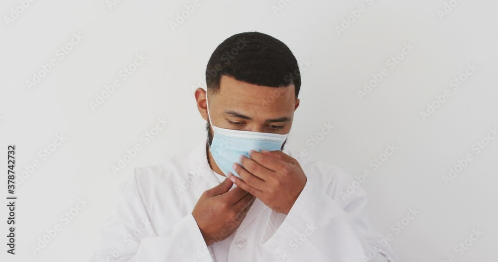 Young man wearing face mask against white background Young man wearing face mask against white background