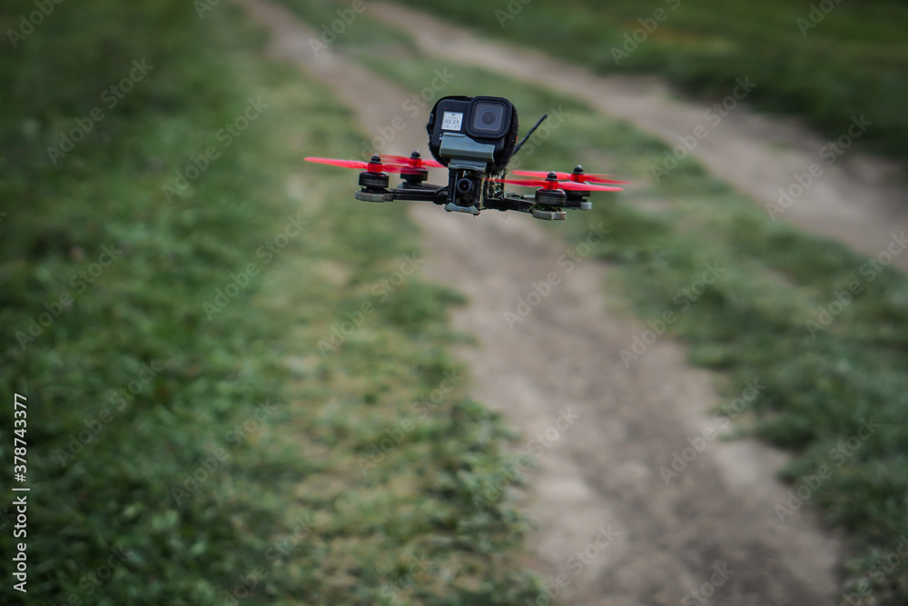 The flying racing drone is ready for the race. The flying racing drone is ready for the race.