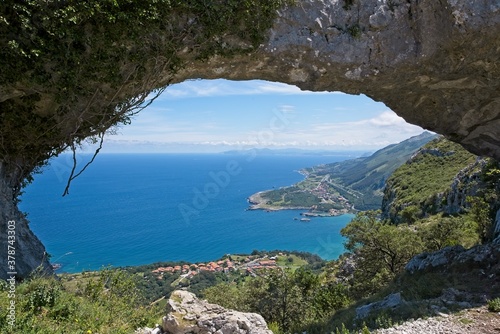 Natural arch in the rock on top of the mountain in Cantabria, Spain