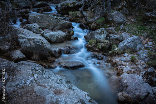 River water flows among the rocks and forms small waterfalls  Rascafr  a  Madrid  Spain