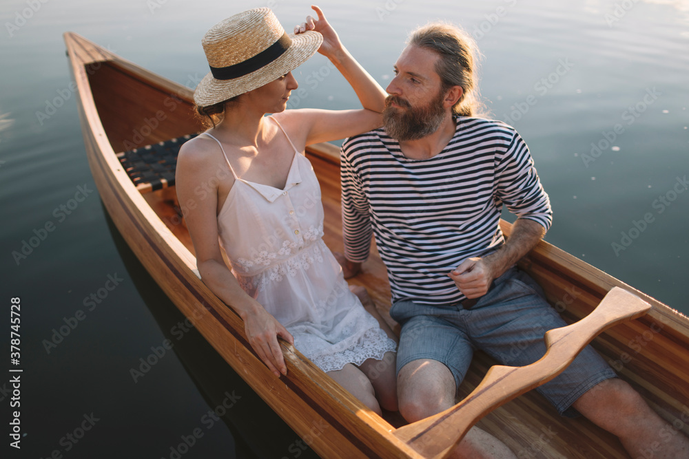 Couple enjoying a summer canoe ride