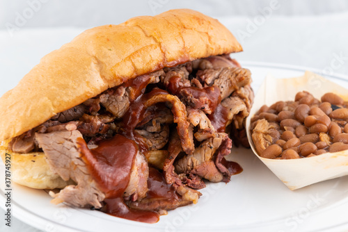 BBQ meal of tri-tip sandwich and baked beans will taste as delicious as it looks.