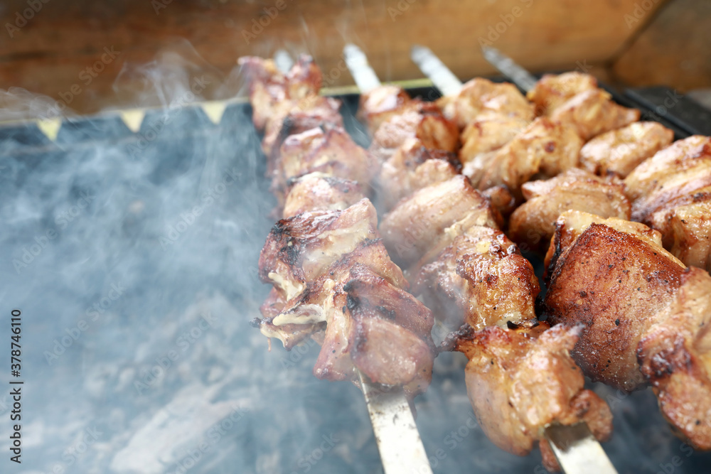 Cooking pork neck skewers on charcoal Cooking pork neck skewers on charcoal
