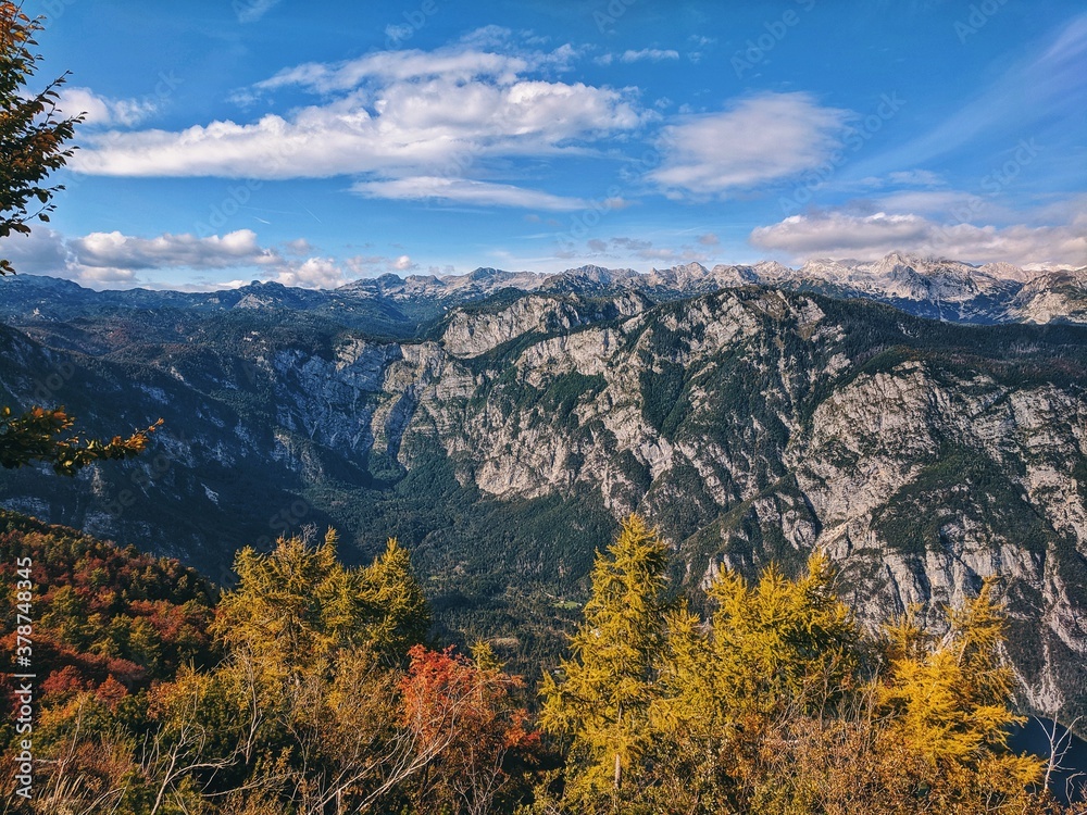 Scenic view of beautiful autumn mountains landscape and blue sky