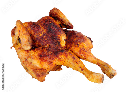 Roasted spatchcock chicken with piri piri seasoning isolated on a white background