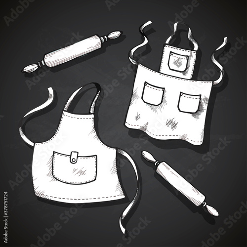 Hand drawn kitchen set. Vector illustration isolated on gray background. Collection of kitchen stuff: chef hat, aprons and rolling pins.