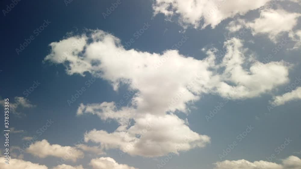 Cloud time lapse background. Blue sky white clouds. Puffy fluffy white clouds. Cumulus cloud sky timelapse. Summer blue sky time lapse. Amazing blue sky. Soft white clouds form. Cloud time lapse background. Blue sky white clouds. Puffy fluffy white clouds. Cumulus cloud sky timelapse. Summer blue sky time lapse. Amazing blue sky. Soft white clouds form.