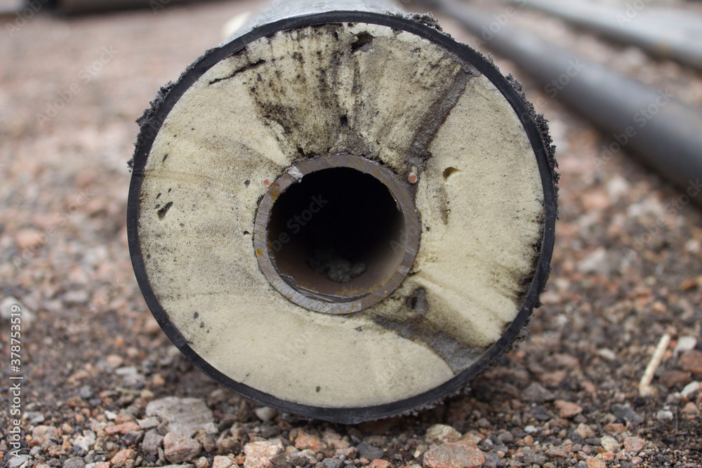 Pipe in polyurethane foam insulation. Thermal insulation of pipes. Pipes for heating and water supply networks.