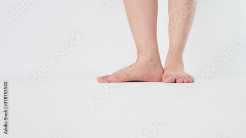 Male legs and barefoot is isolated on white background.