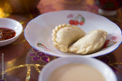 Traditional Tibetan "Momo" dumplings, served in a white plate. 