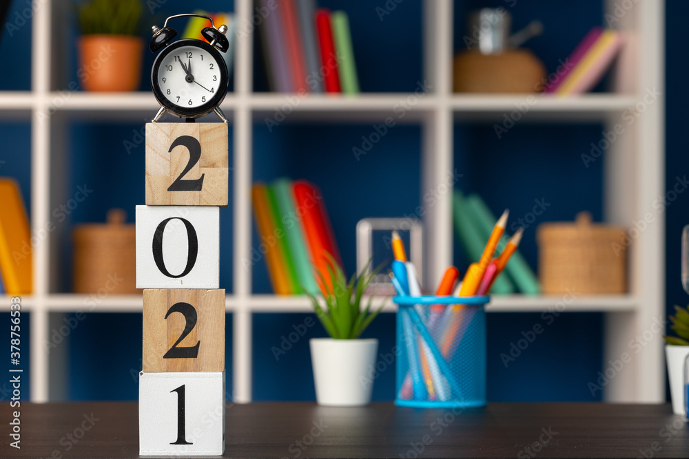 Wooden cubes with year 2021 on working table Wooden cubes with year 2021 on working table