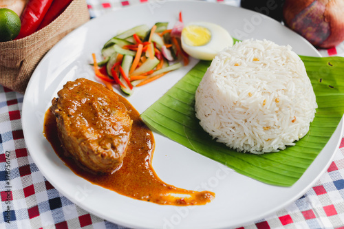 Konstfotografi Traditional Malaysian Nasi Dagang fish curry rice food flat lay.