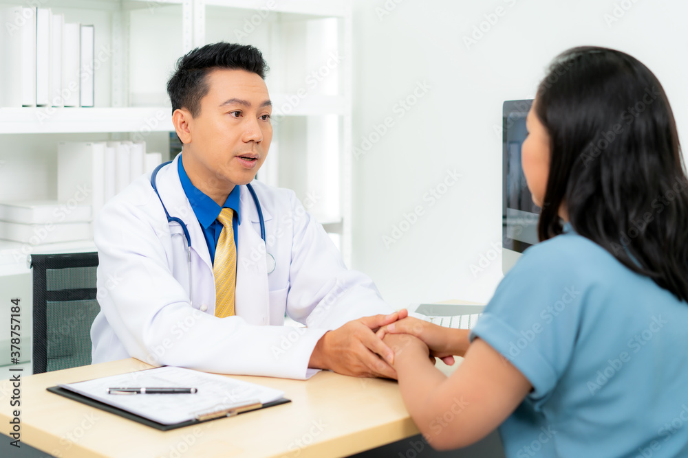 Close up of man doctor touching patient hand for encouragement and empathy on the hospital, cheering and support patient, Bad news, medical examination, trust and ethics. Close up of man doctor touching patient hand for encouragement and empathy on the hospital, cheering and support patient, Bad news, medical examination, trust and ethics.