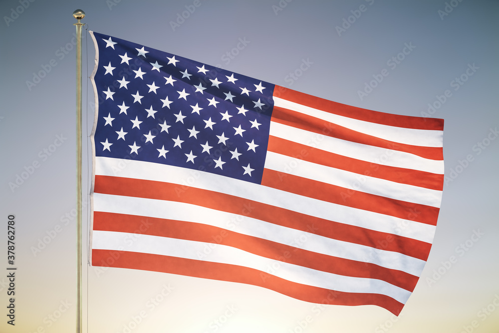 Fototapeta premium USA flag on sunset sky background