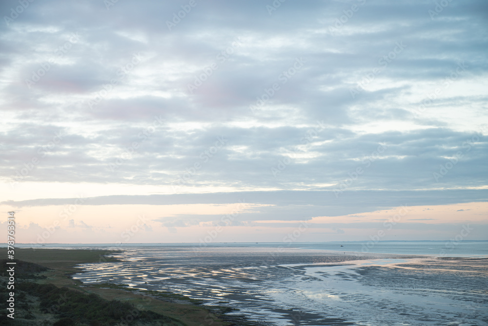 The oerd on Ameland during the sunrise, a beautiful nature area where thousands of water birds breed, Wadden Island, protected nature area, Friesland, the Netherlands The oerd on Ameland during the sunrise, a beautiful nature area where thousands of water birds breed, Wadden Island, protected nature area, Friesland, the Netherlands