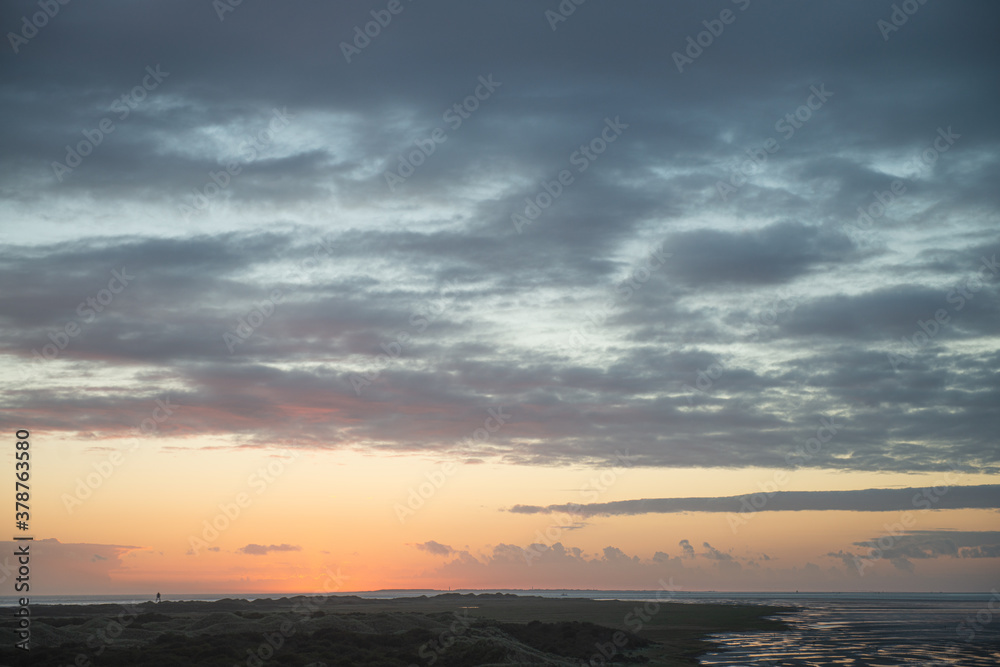 Sunrise in the beautiful protected nature area Het Oerd on the Wadden island of Ameland in the Netherlands, beautiful golden light in the early morning