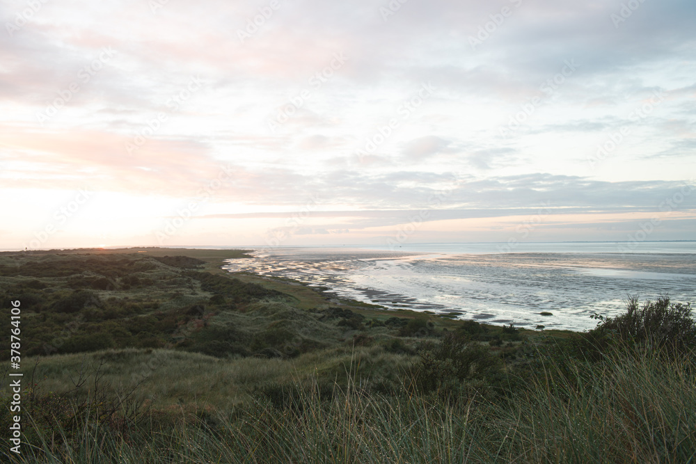 The oerd on Ameland during the sunrise, a beautiful nature area where thousands of water birds breed, Wadden Island, protected nature area, Friesland, the Netherlands The oerd on Ameland during the sunrise, a beautiful nature area where thousands of water birds breed, Wadden Island, protected nature area, Friesland, the Netherlands