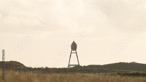  The beacon on Amelend, A cape or sea cape is a beacon for shipping and is a striking landmark in the landscape. on the beautiful Oerd, protected nature area on Ameland, the Netherlands