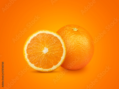 Orange fruit with orange slices isolated on orange background