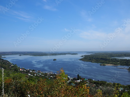 Picturesque panoramic view from the height on the touristic part of the Volga river near Saratov city at summer sunny day.Beautiful natural landscape.Central part of Russia.Europe.