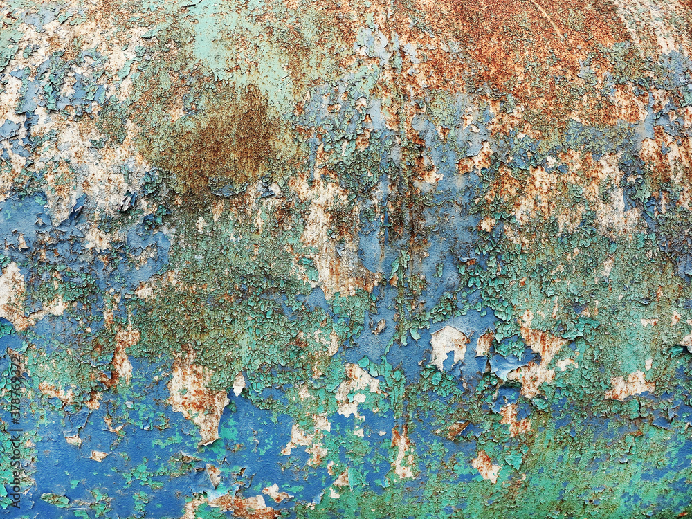 Surface of rusty iron with remnants of old multicolored paint texture ...