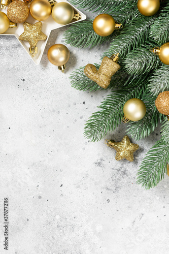 Christmas banner with a Christmas tree and gold decorations on a light background. Christmas or new year flatly. Copyspace