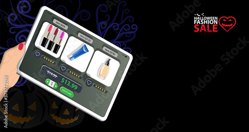 A girl holds a digital tablet with an online cosmetics store for Halloween fashion sale