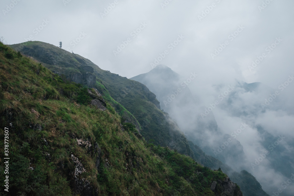 Mountain landscape covered in clouds and fog on Wugong Mountain in Jiangxi, China