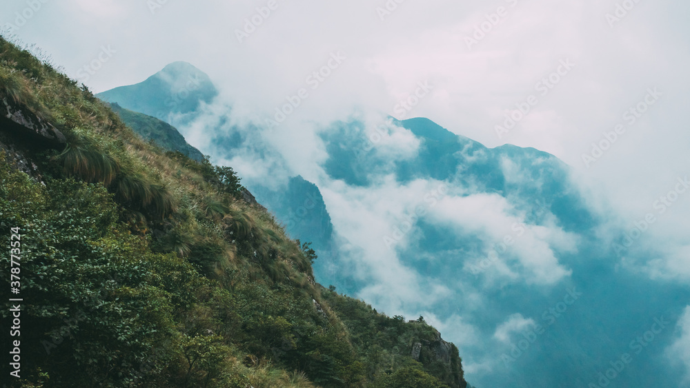 Mountain landscape covered in clouds and fog on Wugong Mountain in Jiangxi, China Mountain landscape covered in clouds and fog on Wugong Mountain in Jiangxi, China