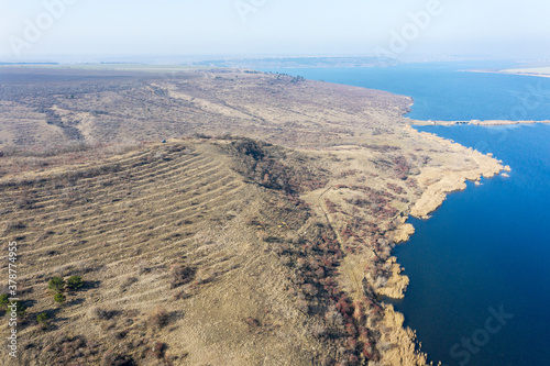 Beautiful landscape from above in haze. Сoast of the Khadzhibey estuary in early spring from a bird's eye view not far from Odessa.