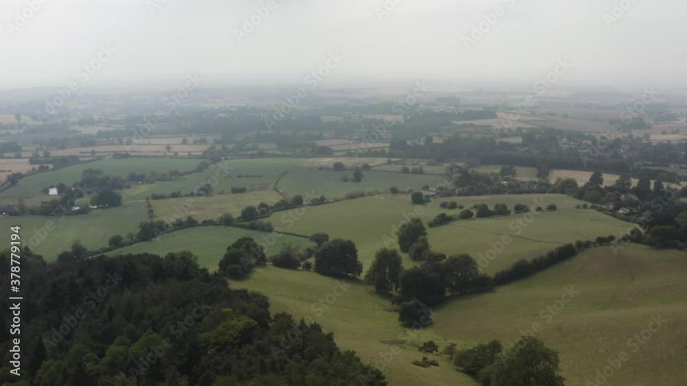 British countryside aerial view with misty overcast clouds British countryside aerial view with misty overcast clouds
