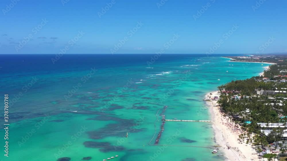 Aerial view on tropical island with resorts and boats floating in caribbean sea. Travel destinations. Summer vacation Aerial view on tropical island with resorts and boats floating in caribbean sea. Travel destinations. Summer vacation