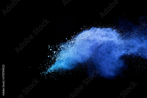 Blue sky color powder explosion on black background.