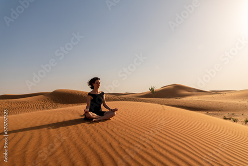 Photos With eyes closed and a posture of tranquility, she is engaged in a deep state of