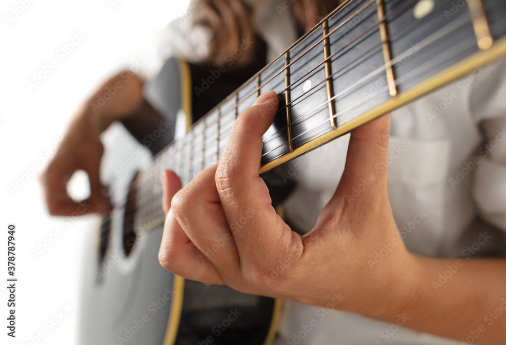 Φωτογραφία Close up of guitarist hand playing guitar, macro shot